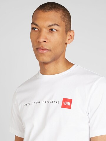 THE NORTH FACE - Camiseta 'NEVER STOP EXPLORING' en blanco