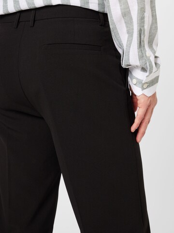 Loosefit Pantaloni con piega frontale di Lindbergh in nero