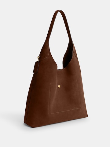 COACH Наплечная сумка в Коричневый