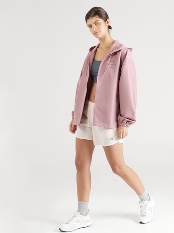 new balance Prehodna jakna 'Iconic Collegiate' | roza barva