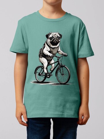 watabout.kids Shirt ' Mops auf Fahrrad ' in Blauw: voorkant