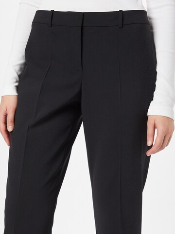 BOSS Slim fit Trousers with creases 'Tiluna' in Black