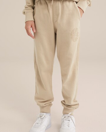 WE Fashion Конический (Tapered) Штаны в Бежевый