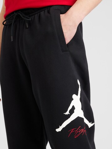 Tapered Pantaloni 'ESS' di Jordan in nero