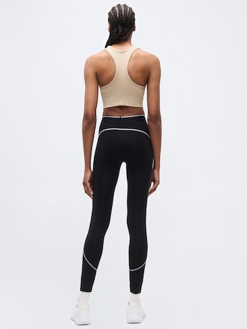 Skinny Pantalon de sport 'Elite' UNDER ARMOUR en noir