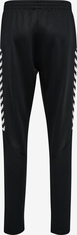 Hummel - Tapered Pantalón deportivo en negro