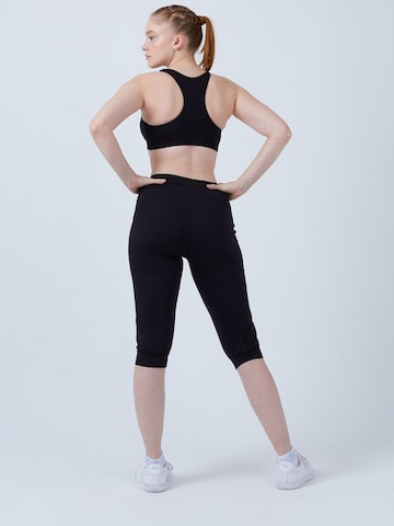 SPORTKIND Loosefit Sporthose 'Caprihose mit Taschen'‌‌‌‌‌ in Schwarz
