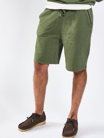 A Question Of (AQO) Regular Pants in Green: front