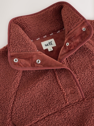 Pull-over self. en marron