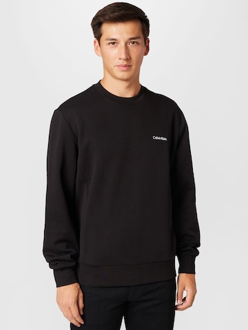 Sweat-shirt Calvin Klein en noir : devant