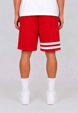 Unfair Athletics Regular Trousers 'DMWU' in Red