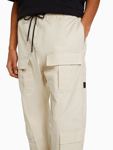 Bershka Tapered Hose in Beige