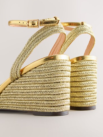 Next - Sandalias en oro