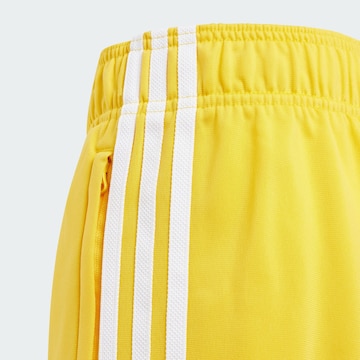 ADIDAS ORIGINALS Tapered Pants 'Adicolor SST' in Yellow