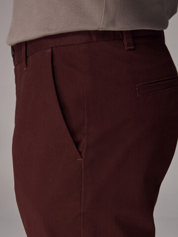 Next Slimfit Chinohousut värissä punainen
