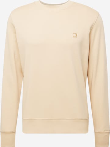 Sweat-shirt Calvin Klein Jeans en beige : devant