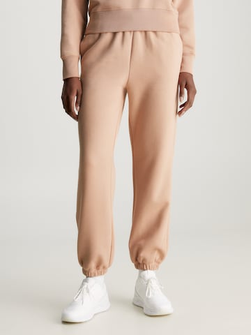 Calvin Klein Loose fit Pants in Beige: front