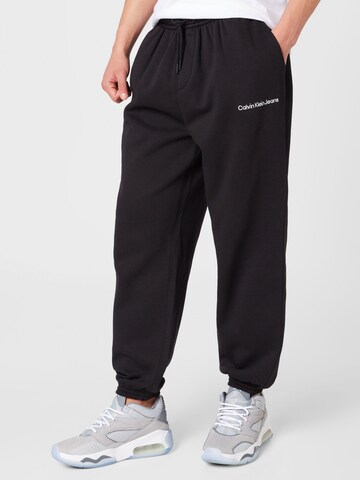 Calvin Klein Jeans Tapered Pants in Black: front