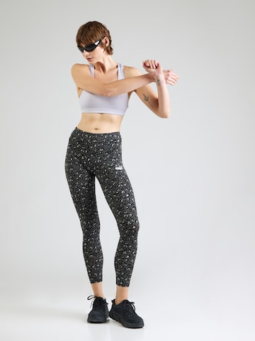 PUMA Skinny Urheiluhousut 'Essentials' värissä musta