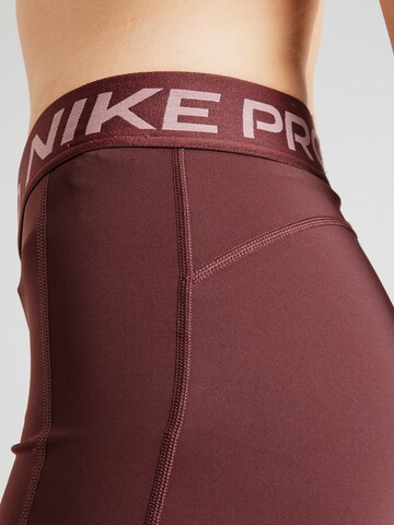 Skinny Pantalon de sport NIKE en violet