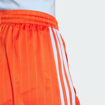 ADIDAS ORIGINALS Свободный крой Штаны в Оранжевый