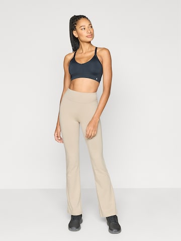 Evazați Pantaloni sport de la Champion Authentic Athletic Apparel pe bej