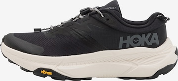 HOKA Juoksukengät 'TRANSPORT' värissä musta: etupuoli