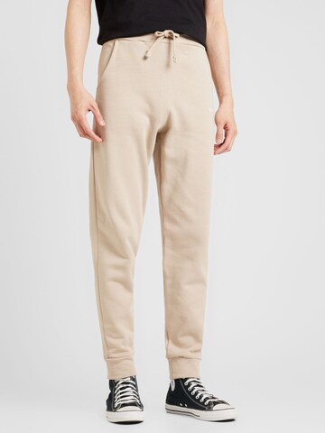 ALPHA INDUSTRIES Tapered Broek in Beige: voorkant