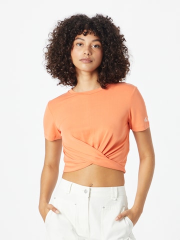 Tricou de la Calvin Klein Jeans pe portocaliu: față