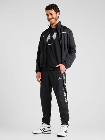 ADIDAS SPORTSWEAR Regular Urheiluhousut 'Pride Tiro' värissä musta