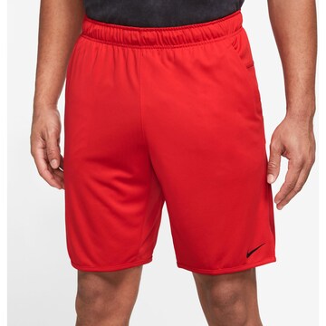 NIKE Regular Workout Pants 'Totality' in Red