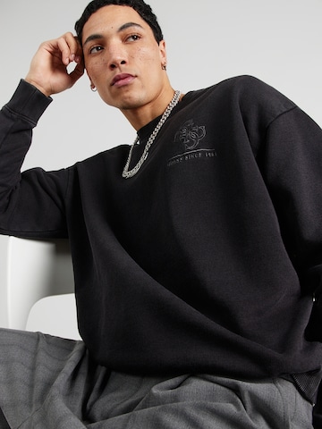 GUESS - Sudadera en negro
