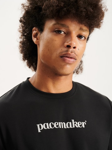 Pacemaker قميص عملي بلون أسود