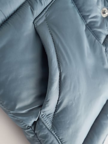 Next - Chaleco en gris