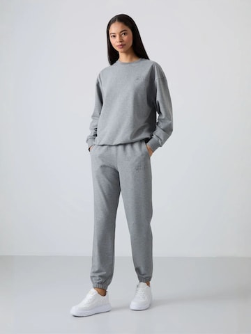 Tuta da jogging di Tommy Life in grigio: frontale
