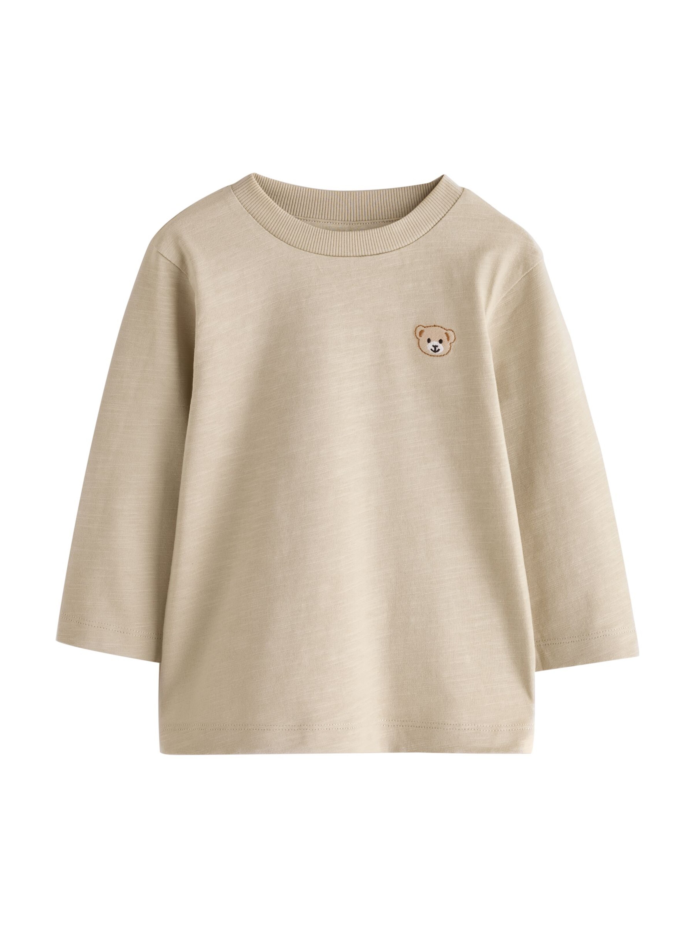 Tricou de la Next pe bej