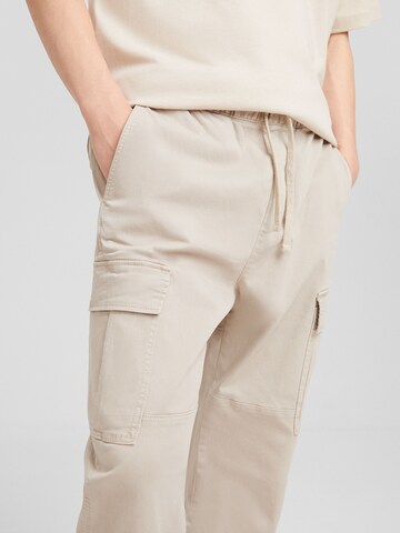 Bershka Tapered Cargobukser i beige