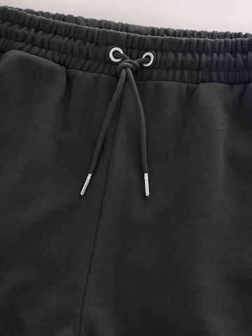 Tapered Pantaloni di Next in nero