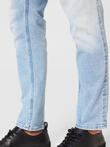 Tommy Jeans Slimfit Farkut 'Austin' värissä sininen