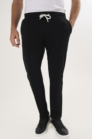 Felix Hardy Regular Trousers in Black: front