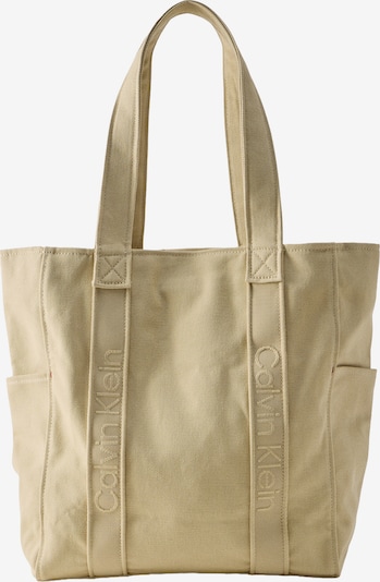 Pirkinių krepšys iš Calvin Klein, spalva – rusvai žalia, Prekių apžvalga