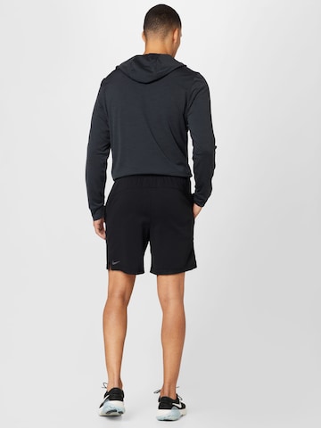 NIKE Regularen Športne hlače | črna barva
