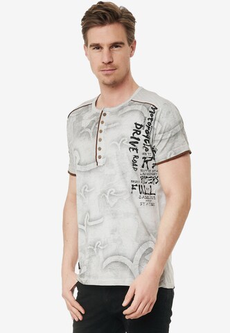 Rusty Neal T-Shirt mit lässigem Allover-Print in Grau: predná strana