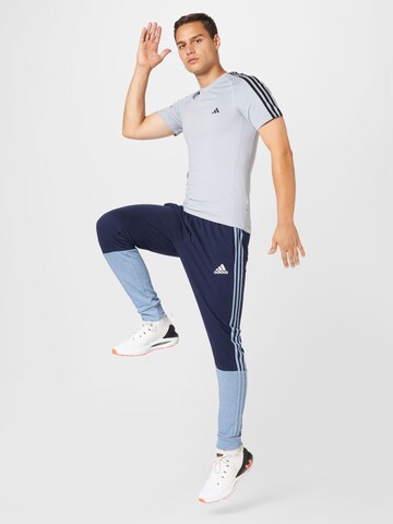 mėlyna ADIDAS SPORTSWEAR Siaurėjantis Sportinės kelnės 'Essentials Mélange French Terry'