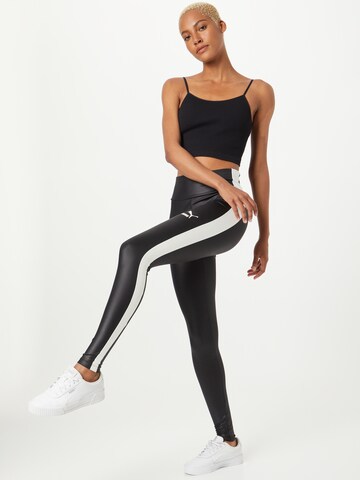 PUMA Skinny Urheiluhousut 'T7 Shiny' värissä musta