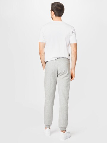 ELLESSE - Tapered Pantalón deportivo 'Kylian' en gris