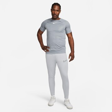 NIKE Slim fit Workout Pants 'Academy' in Grey
