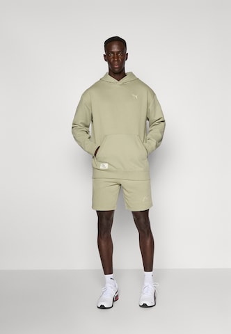 PUMA Regularen Športne hlače 'CLASS 8' | zelena barva