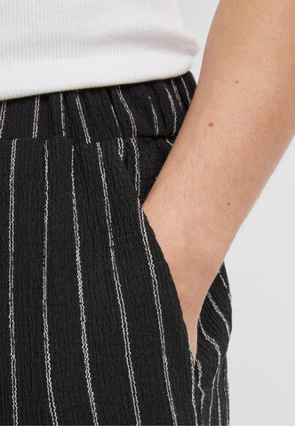 évasé Pantalon Urban Classics en noir