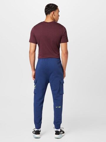 Effilé Pantalon cargo Nike Sportswear en bleu